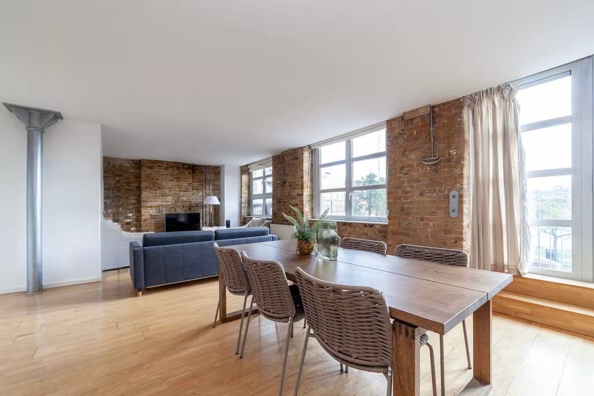 a kitchen with a table and chairs
