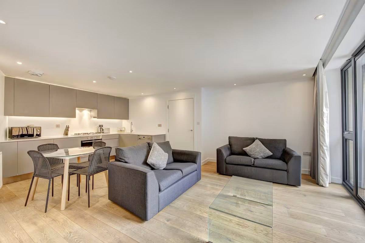 a kitchen with a table and chairs