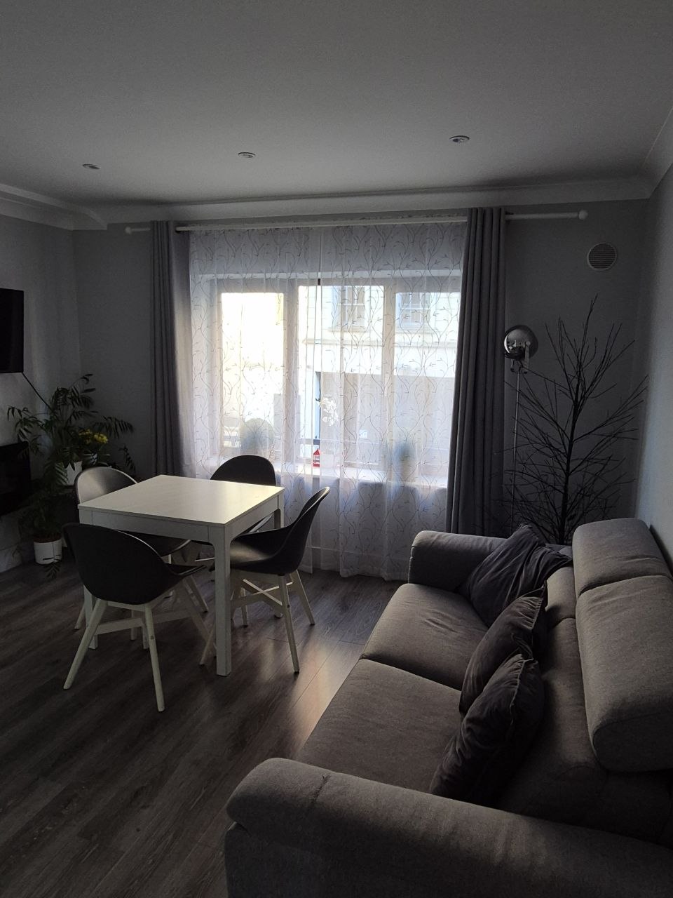 a kitchen with a table and chairs